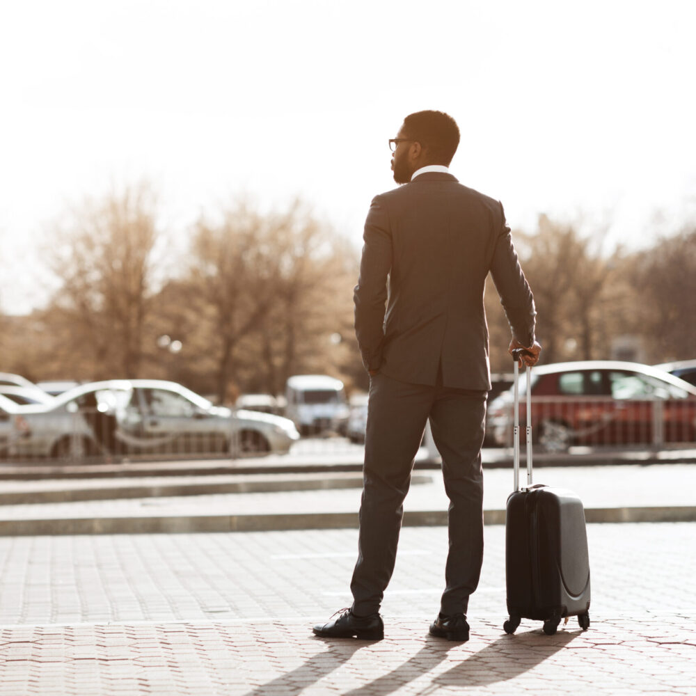 Wait for Airport Taxi. Businessman Arriving for Business Trip, Standing with Baggage